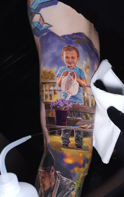 Painterly realism portrait tattoo — boy with watering can