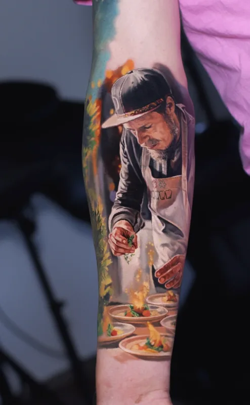 Color realism tattoo — chef portrait with flambé